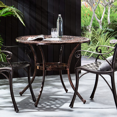 Table de salle à manger d'extérieur en aluminium coulé de couleur cuivre - à la mode et brillante