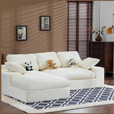 White corduroy compressed sofa. It has a soft and skin-friendly sitting feel, adding a healing atmosphere to the warm living room. It comes with 3 back cushions and 2 throw pillows.