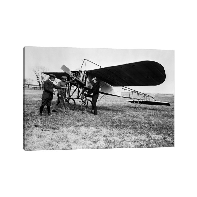 1910S Group Of Three Men Standing In Front Of Early Monoplane One With Hand On Propeller - Wrapped Canvas Print