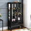 Armoire à vin à 2 portes avec système d'éclairage intégré, tablettes réglables, finition noire, tiroir caché et dossier en miroir - Créez un éclairage captivant et curieux