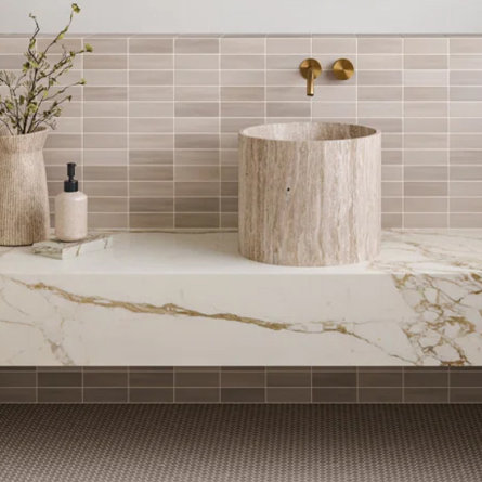 Bathroom with marble counter and vessel sink.