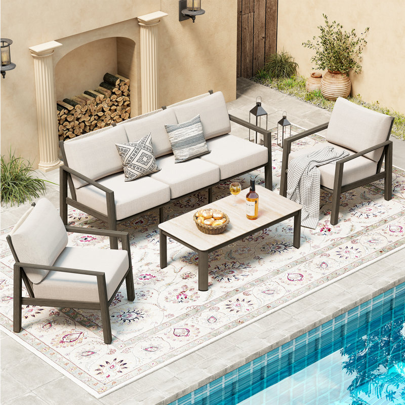 Nimbus 4-Piece Brown Aluminum Patio Conversation Set With Light Gray Cushions And Coffee Table