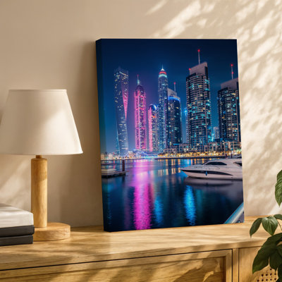 Canvas A Vibrant Night Scene Of Dubai S Skyline Showcasing A Wall Art Cluster Of Modern Skyscrapers Illuminated With Colorful Lights Canvas Wall Art