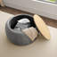 Repose-pieds rond avec rangement Dariyan-944897203
