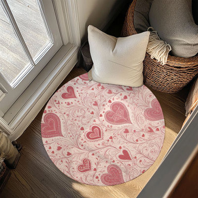 Tapis tressé à motif de cœurs roses