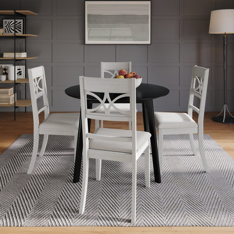 Ensemble de salle à manger 5 pièces avec table ronde noire et chaises rembourrées blanches au design complexe, Blanc