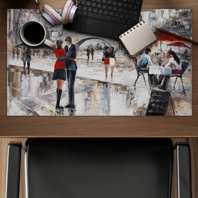 Young couple hugging in the street - 14.00"x24.25" Desk mat