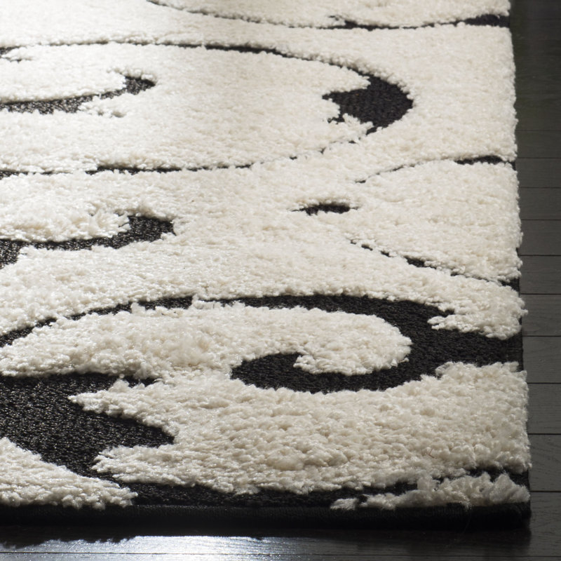 Tapis floral en polypropylène tissé à la machine Tess en ivoire / noir, Rectangle 5 pi 3 po x 7 pi 6 po