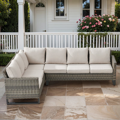 Nazime 105.1" Wide Outdoor Wicker Patio Sectional with Cushions by Latitude Run