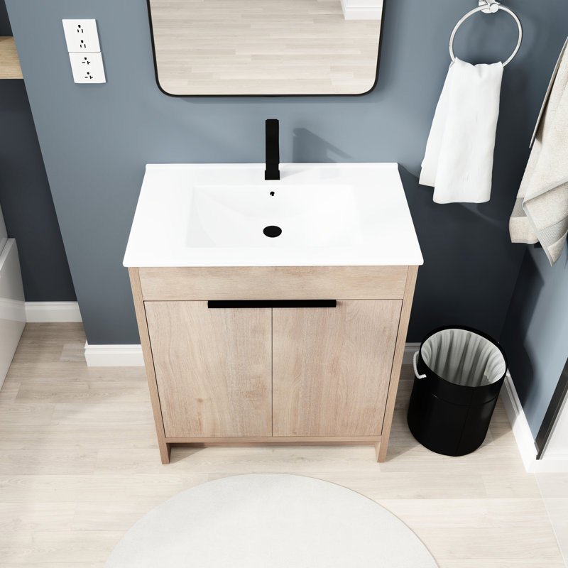 Meuble-lavabo autoportant de 30 po avec lavabo en céramique blanche. 2 portes d'armoire à fermeture en douceur. Design moderne. Chêne uni. Contreplaqué. Tablette réglable. Poignées en métal pour un style élégant. Moderne. Charmant