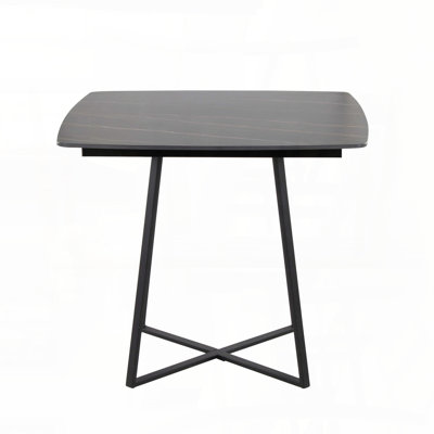 Table de salle à manger avec base en métal noir et plateau en céramique effet marbre noir