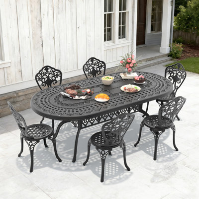 Table de salle à manger d'extérieur ovale en aluminium moulé de 81,89 po L avec trou pour parasol et 6 chaises avec une largeur d'assise de 15,35 po (ensemble de 7 pièces)
