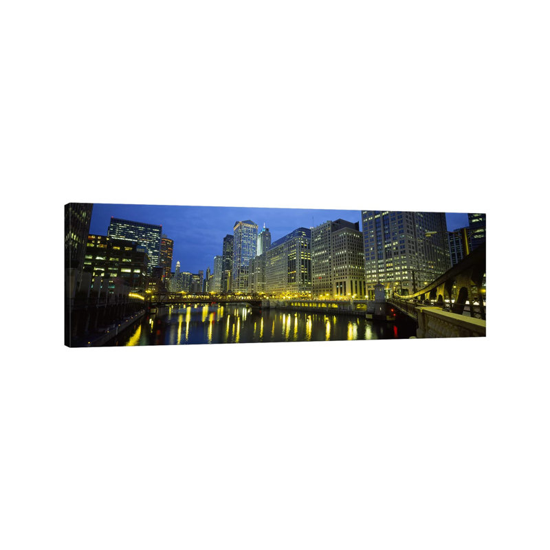 Low Angle View Of Buildings Lit Up At Night, Chicago River, Chicago, Illinois, USA by Panoramic Images - Wrapped Canvas Panoramic Print