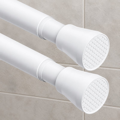 Cet ensemble de 2 petites barres de douche blanches à ressort s'ajuste de 28 à 48 pouces ; leur conception extensible et antidérapante s'installe facilement sans perçage dans les salles de bain et les placards.