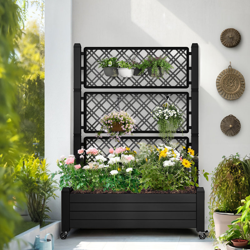 Boîte à fleurs noire avec treillis et roues verrouillables