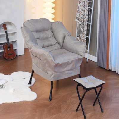 Grand canapé-lit en tissu avec accoudoirs et repose-pieds