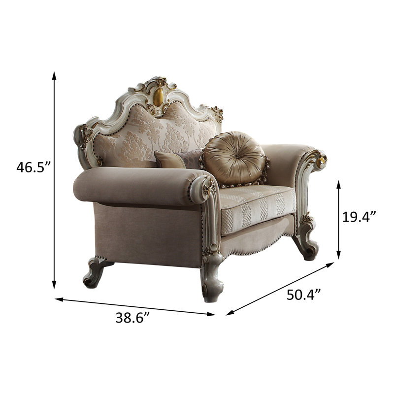 Fauteuil capitonné large Mariel