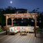 Pavillon de jardin pergola en bois robuste avec toit en métal et comptoirs à la mode Raison Design