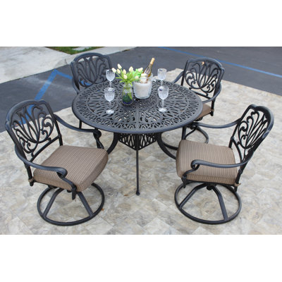 Waynesville 4 - Person Patio Dining Set Umbrella Hole Included Round Table with Cushions Included