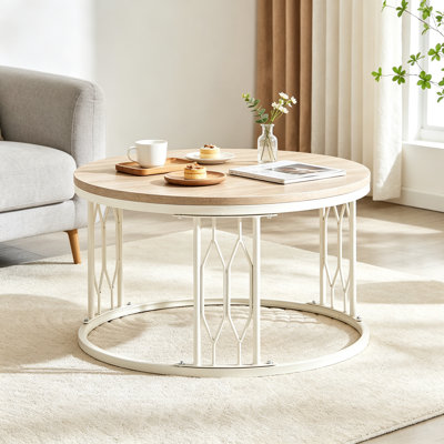 Table basse ronde de 70 cm (27,5 po) effet pierre blanche, plateau en MDF et structure métallique ajourée blanc crème, style wabi-sabi moderne pour la maison ou un appartement.