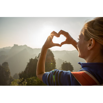 Young Woman Loving Nature by Swissmediavision
