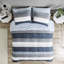 Édredon avec draps à rayures bleu marine et gris - soin de la peau et motif de draps Peaceful Rest