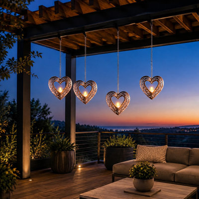 This 4 Pack of 4.75in Heart lanterns contains Solar Tea Lights in waterproof hanging housings for outside trees, pergolas, or patio decor, including wish-themed Valentine's Day and Wedding gifts for her.