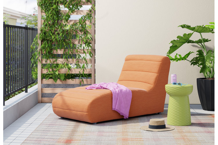 modern apartment patio with an orange patio lounge and a trellis