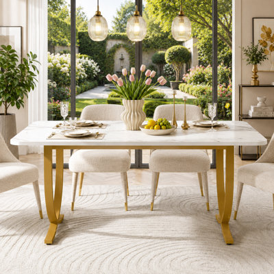 A modern, affordable luxury dining table featuring a faux-marble finish; versatile enough to serve as a formal dining table or a kitchen prep table.
