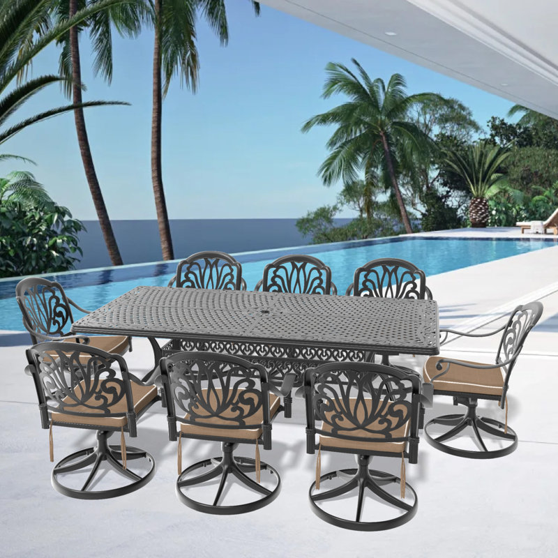 Cet ensemble de salle à manger en fonte d'aluminium toutes saisons comprend des chaises pivotantes et une table rectangulaire avec cadre noir