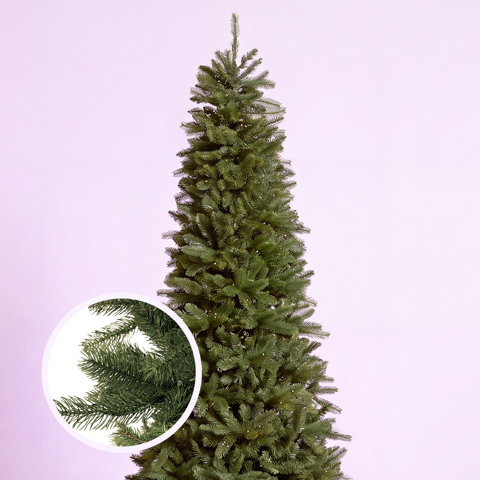 Tall, slim artificial Christmas tree with a detailed circular close-up inset showing realistic green needle textures against a light purple background.