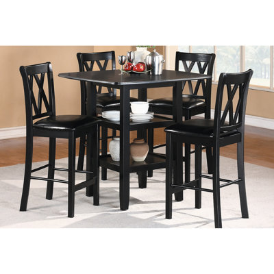Table et chaise de salle à manger hautes, noires, avec tablettes du bas et revêtement en similicuir.