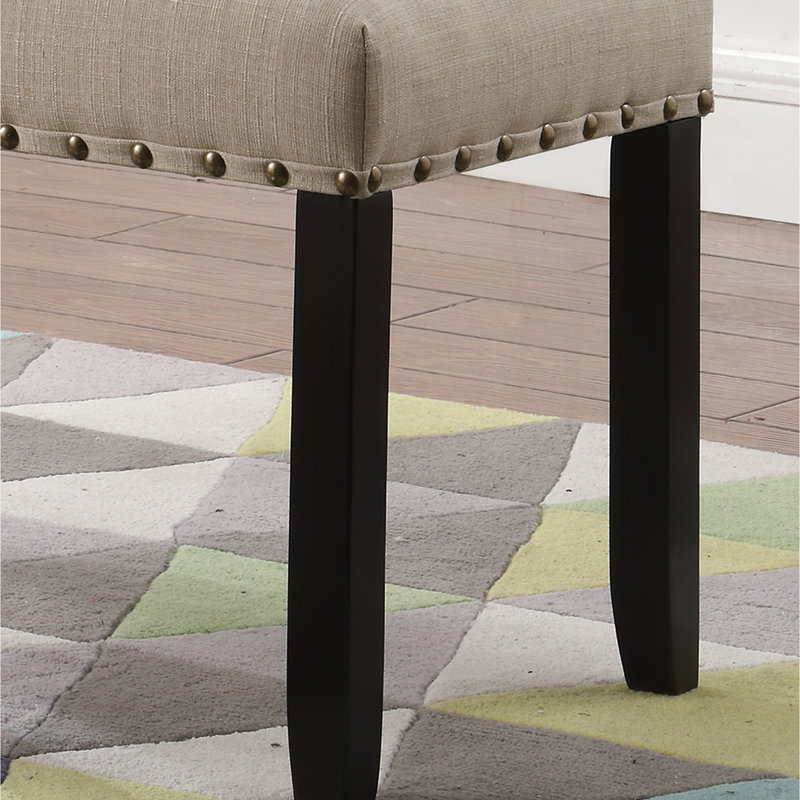 Dining Bench In Tan Style. Linen And Cotton Seat. Hardwood Legs For Stability. 44"W X 16.5"D 19"H. Some Assembly Is Unavoidable Nailhead Trim Tan. Fabric With & Cotton. Solid Dimensions: Necessary