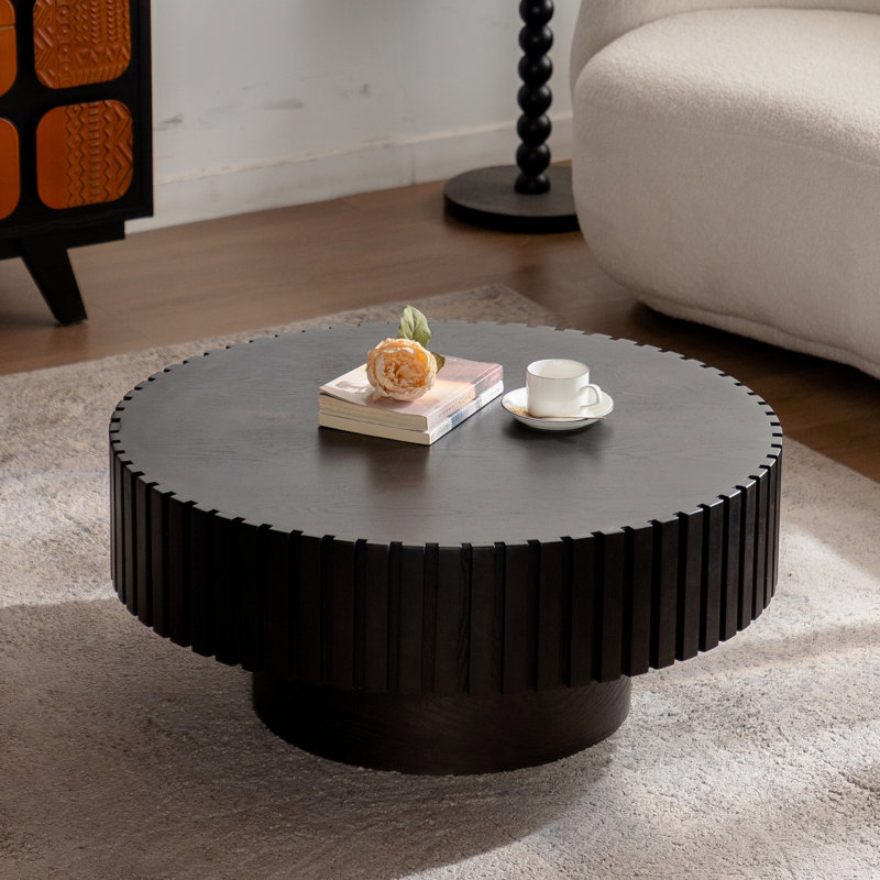 Table basse ronde avec base piédestal robuste pour le salon