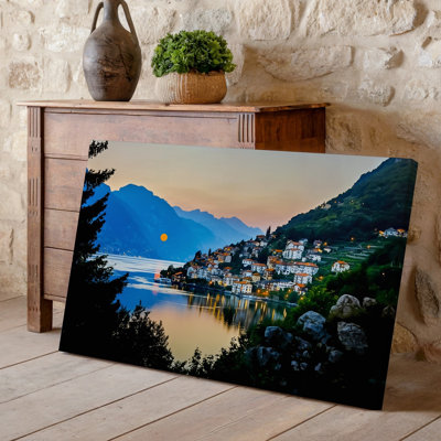 Canvas A Serene Twilight Scene Depicting A Quaint Village Nestled Against Wall Art A Mountainside Illuminated By Warm Golden Lights Canvas Wall Art