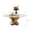 Table basse ronde en faux marbre avec base géométrique dorée en X, décor glamour pour espaces éclectiques et contemporains