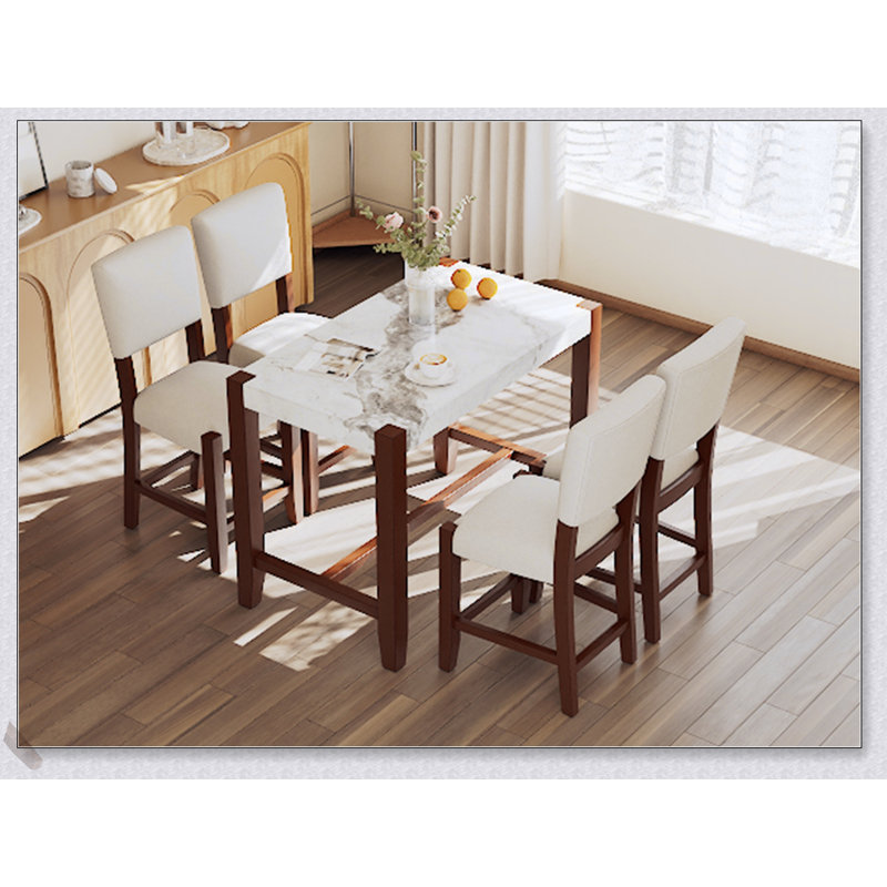 Ensemble de table de salle à manger 5 pièces à hauteur de comptoir avec plateau en faux marbre et chaises rembourrées, parfait pour les petits espaces modernes