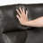 Morfudd 50" Modern & Contemporary Faux Leather Manual Reclining Loveseat with Integrated Armrest with Magazine Pocket and Secure Attached Back and Seat Cushions