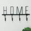 4 crochets muraux noirs
