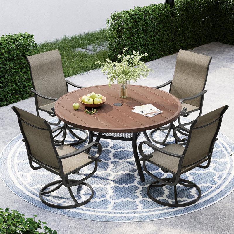 Ensemble repas pour 4 personnes avec table de salle à manger ronde et 4 chaises pivotantes en textilène