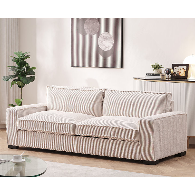 Canapé confortable en velours avec accoudoirs élégants pour des moments de détente, Beige