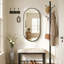 Miroir mural ovale en métal-669632244