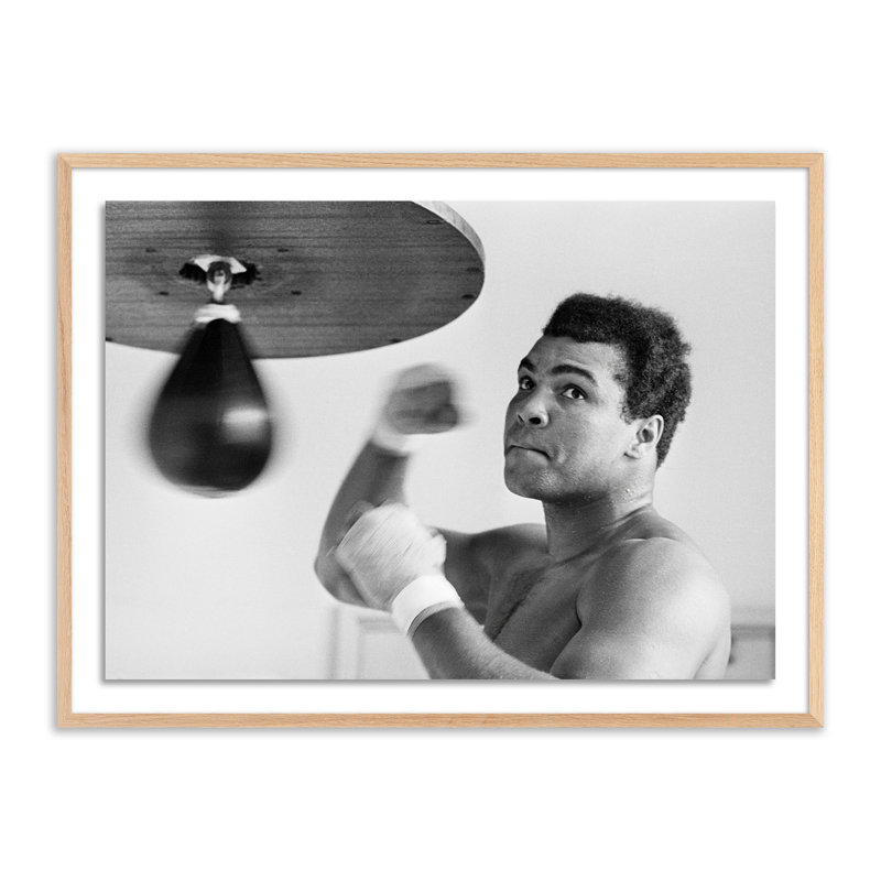 Muhammad Ali Punching Bag Print by Getty Images, 36" H x 48" W, Black Maple Framed