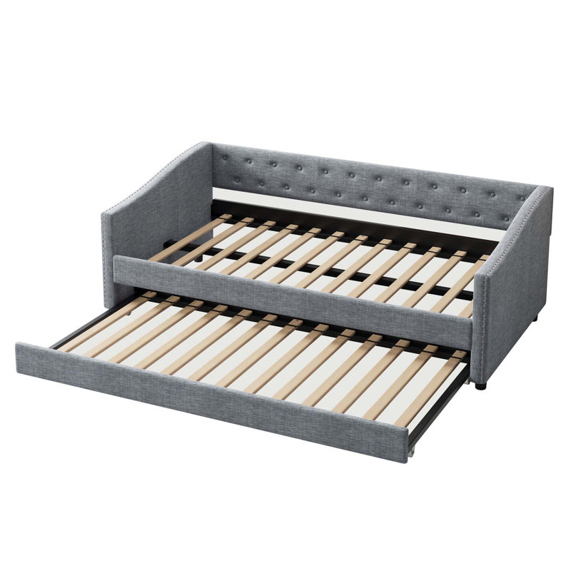 Lit de jour simple avec lit gigogne, tablettes de rangement et bureau d'étude intégré pour une utilisation multifonctionnelle peu encombrante.