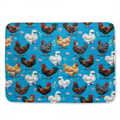Poulets colorés sur tapis de bain bleu