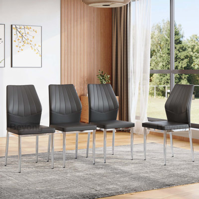 Ensemble de 4 chaises de salle à manger noires et argentées, d'une hauteur de 37 pouces: dossier ergonomique en polyuréthane, alliant confort et style. Combine confort et élégance, ajoutant plus de confort et de style à l'heure du repas.