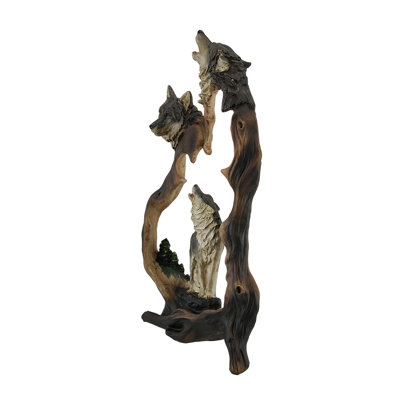 Statue découpée de loups hurlants