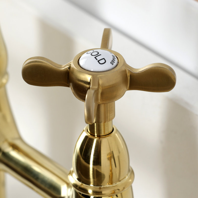 Kingston Brass Bel-Air Two-Handle 4-Hole Deck Mount Bridge Kitchen Faucet with Brass Side Sprayer, Brushed Brass, Cross