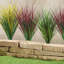 Faux buissons d'herbe décoratifs-487864473