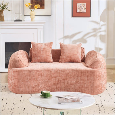 Curved two - person compress sofa. It has armrests on both sides, comes with two pillows, is suitable for small - sized apartments, and can be placed in the living room or bedroom.
